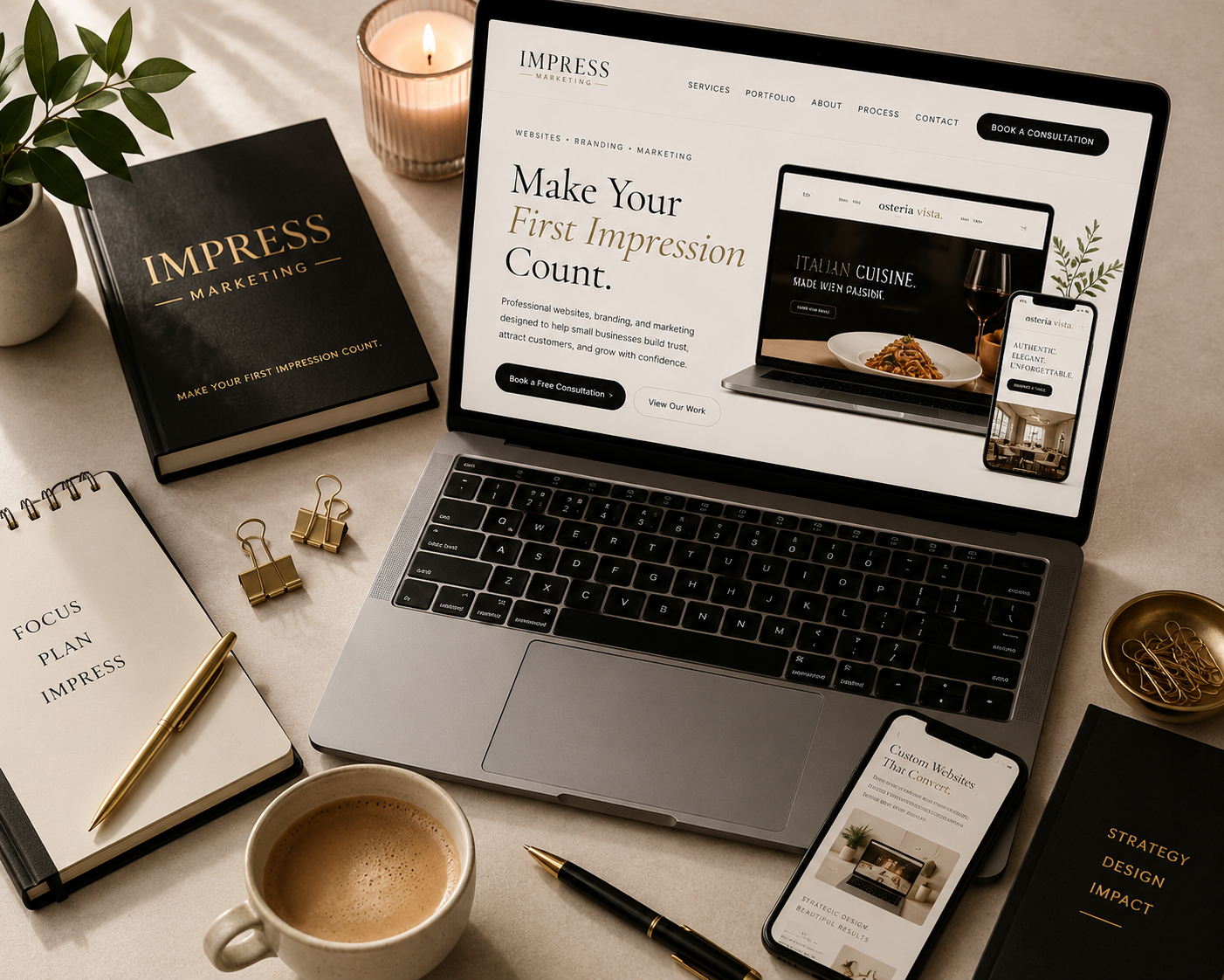 IMPRESS Marketing desk setup with a laptop showing the website, branded notebook, and coffee